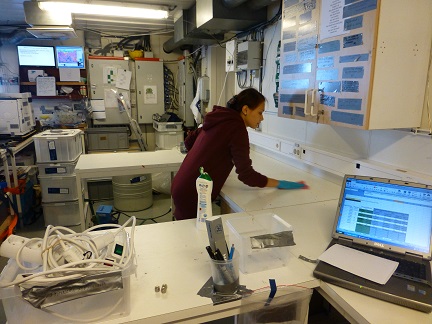 Kseniia cleaning the former stripping area.