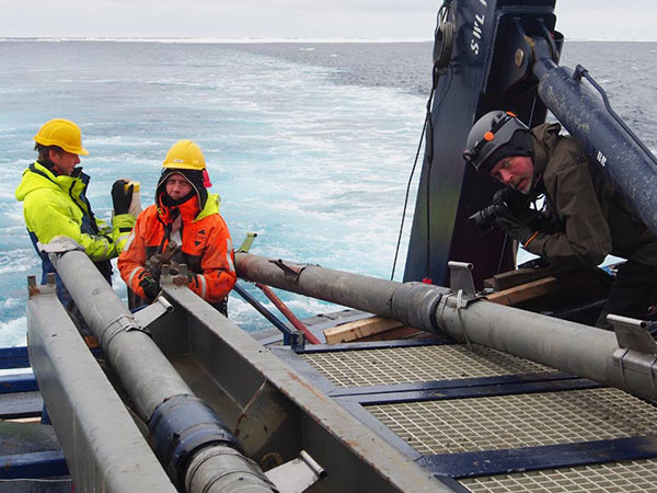 Björn Eriksson documenting sediment coring procedures. The stainless steel devices mounted on the core barrel are holders from temperature probes used to measure the temperature of the Arctic Ocean sediments with. Sediment temperature is one of the critical parameters for numerical modeling of the stability of gas hydrates in slope sediments. Björn Eriksson documenting sediment coring procedures. The stainless steel devices mounted on the core barrel are holders from temperature probes used to measure the temperature of the Arctic Ocean sediments with. Sediment temperature is one of the critical parameters for numerical modeling of the stability of gas hydrates in slope sediments.